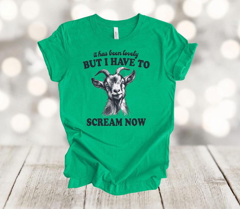 May include: Green t-shirt with a black and white goat illustration and the text "it has been lovely BUT I HAVE TO SCREAM NOW".