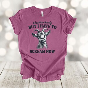May include: A pink t-shirt with a goat illustration and the text "it has been lovely BUT I HAVE TO SCREAM NOW".