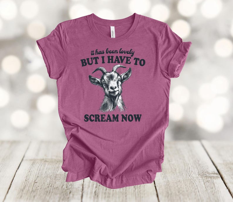 May include: A pink t-shirt with a goat illustration and the text "it has been lovely BUT I HAVE TO SCREAM NOW".