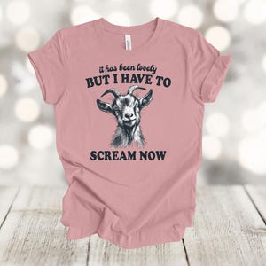 May include: A pink t-shirt with a goat illustration and the text "It has been lovely BUT I HAVE TO SCREAM NOW".