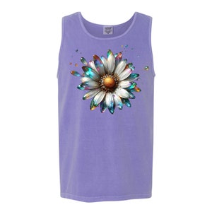 May include: A purple tank top with a colorful iridescent daisy graphic print.