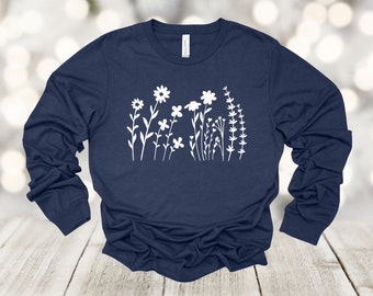 Camisa de manga larga con estampado floral: Siluetas de flores blancas, Bella Canvas Unisex