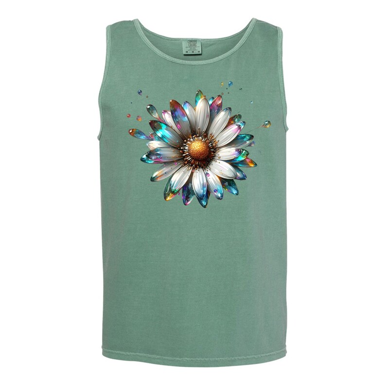 May include: A green tank top with a white daisy flower graphic. The flower has iridescent blue, green, and purple petals and a gold center.