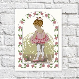May include: Cross-stitch artwork of a young ballerina in a pink tutu and crown, viewed from the back. The design is framed by a floral archway with pink roses and green leaves. The background is a light green.