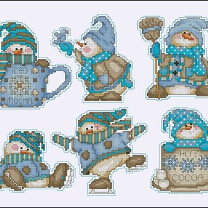 May include: Six charming snowman ornaments with blue and brown accents. Each snowman is holding a different winter-themed item, such as a mug of hot cocoa, a broom, and a bird.