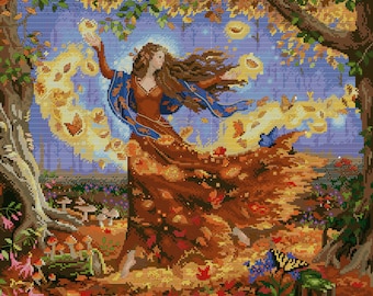 May include: A woman with long brown hair dances in a forest, surrounded by swirling autumn leaves. She wears a blue and brown dress with a flowing skirt. The leaves are in shades of yellow, orange, and red, and the background is a blur of blue and purple.