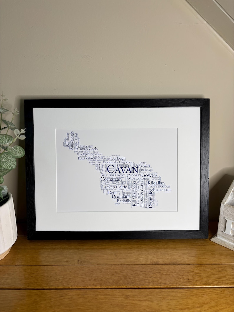 Cavan GAA Irish Themed Word Art Poster Print by Ireland With Love Printed in sizes A5 A4 and A3 offered as print only, framed or matted with all the Cavan GAA clubs listed in the Cavan colours in the shape of county Cavan this print can also be personalised
