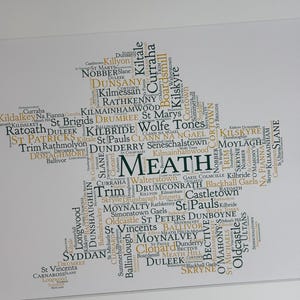 Meath GAA Clubs Irish Themed Word Art Poster Print by Ireland With Love Printed in sizes A5 A4 and A3 offered as print only, framed or matted with all the county GAA clubs listed in the county colours in the shape of the county, this print can also be personalised
