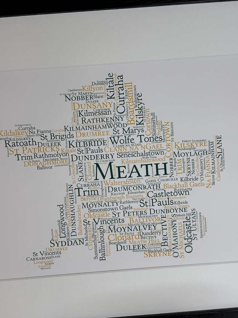 Meath GAA Clubs Irish Themed Word Art Poster Print by Ireland With Love Printed in sizes A5 A4 and A3 offered as print only, framed or matted with all the county GAA clubs listed in the county colours in the shape of the county, this print can also be personalised