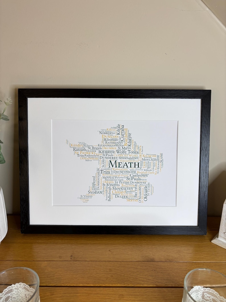 Meath GAA Clubs Irish Themed Word Art Poster Print by Ireland With Love Printed in sizes A5 A4 and A3 offered as print only, framed or matted with all the county GAA clubs listed in the county colours in the shape of the county, this print can also be personalised