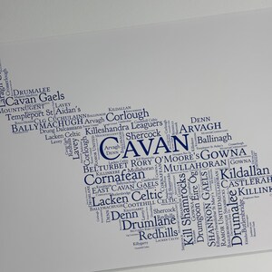 Cavan GAA Irish Themed Word Art Poster Print by Ireland With Love Printed in sizes A5 A4 and A3 offered as print only, framed or matted with all the Cavan GAA clubs listed in the Cavan colours in the shape of county Cavan this print can also be personalised