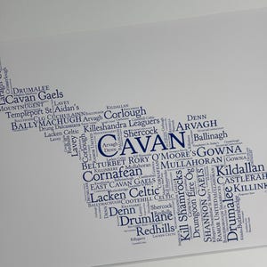 Cavan GAA Irish Themed Word Art Poster Print by Ireland With Love Printed in sizes A5 A4 and A3 offered as print only, framed or matted with all the Cavan GAA clubs listed in the Cavan colours in the shape of county Cavan this print can also be personalised