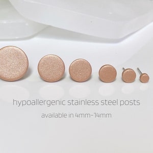 May include: Five round, rose gold-colored stud earrings with hypoallergenic stainless steel posts. The earrings are available in sizes 4mm to 14mm.  hypoallergenic stainless steel posts available in 4mm-14mm