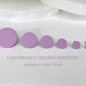 May include: A set of six purple round stud earrings in various sizes, ranging from 4mm to 14mm. The earrings are made with hypoallergenic stainless steel posts.