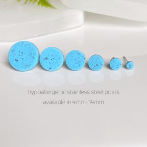 May include: Six turquoise blue speckled round stud earrings of varying sizes, with hypoallergenic stainless steel posts.  Available in sizes 4mm-14mm.