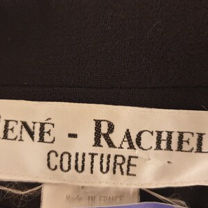 May include: White label with black text that reads "RENE - RACHEL COUTURE" and "Made in France".