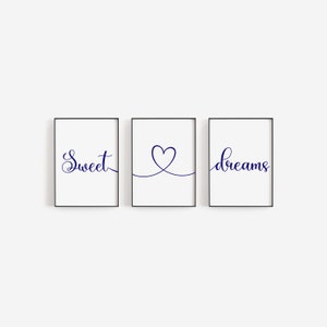 May include: Three framed prints with the words "Sweet", a heart shape, and "dreams" in navy blue cursive font.
