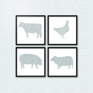 May include: Four framed illustrations of different animals, each showing the different cuts of meat. The illustrations are in a light blue color and are set against a white brick wall background.