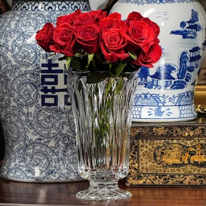 May include: A rustic wooden sign with the text "Welcome to our home" in white lettering. The sign features a distressed finish and a simple, inviting design, perfect for entryway decor.