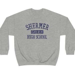 May include: Grey sweatshirt with a navy blue print that reads "Shermer High School Class of '84".