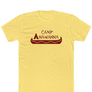 May include: Yellow short-sleeved t-shirt with a red graphic of a canoe and the text "Camp Anawanna".