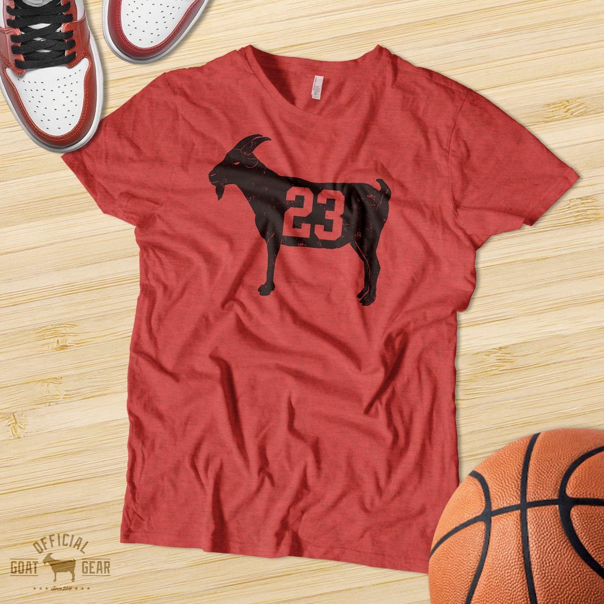 Michael Jordan goat silhouette in Chicago Bulls number 23 jersey and  basketball sneakers on Essential T-Shirt by COURT-VISION