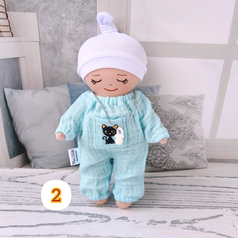 2. Baby doll in a light blue romper