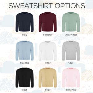 May include: Nine different color options for a sweatshirt. The colors are navy, burgundy, dusky green, sky blue, white, grey, black, beige, and baby pink.