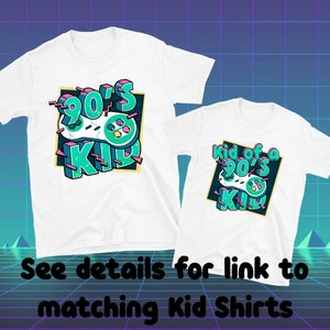 May include: Two white t-shirts with a retro 90's design. The larger shirt says "90's Kid" with a green and blue video game controller. The smaller shirt says "Kid of a 90's Kid".
