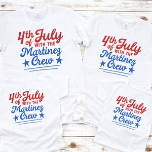 May include: Four white t-shirts with red and blue text that reads "4th July of with the Martinez Crew" and a blue star on each side of the word "Crew".
