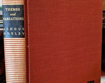 May include: A red hardcover book with the title "Themes and Variations" by Aldous Huxley. The book is published by Harper.