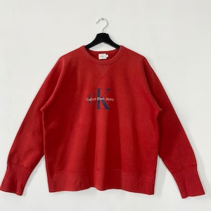 Bluza Calvin Klein z lat 90. z okrągłym dekoltem i haftowanym logo Calvin Klein Jeans, rozmiar średni