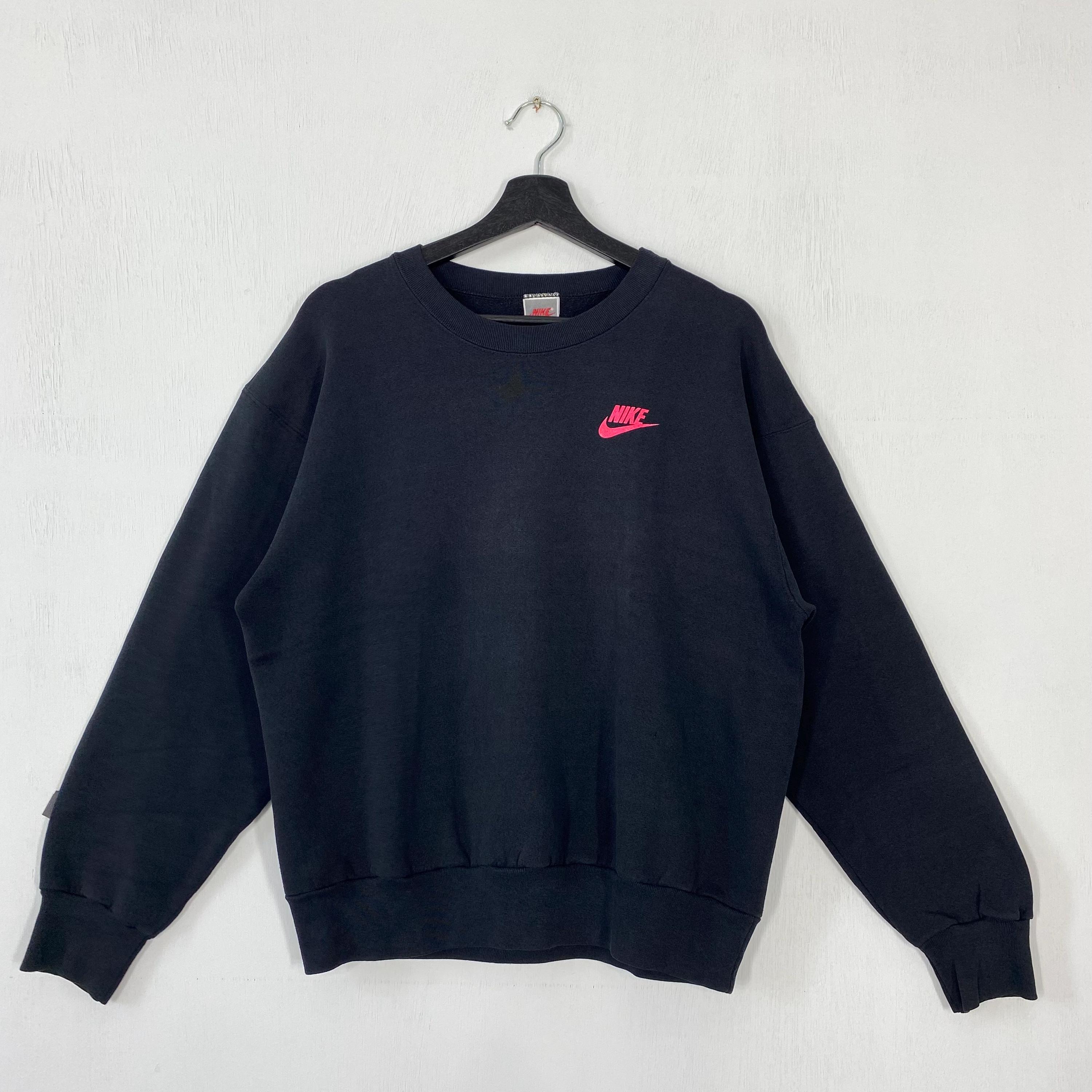 black nike sweatshirt with red tick