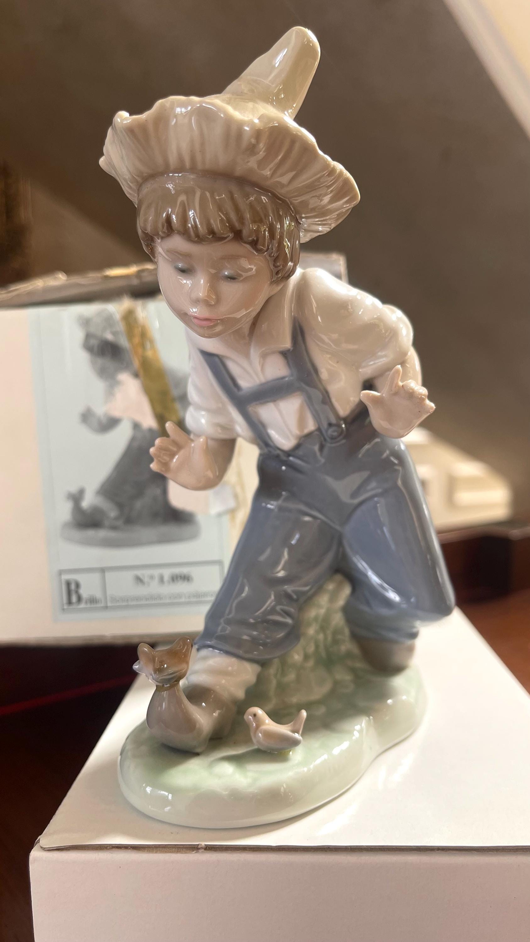 NAO by Lladro Porcelain “boy With the Bird's” No.1096 Figurine