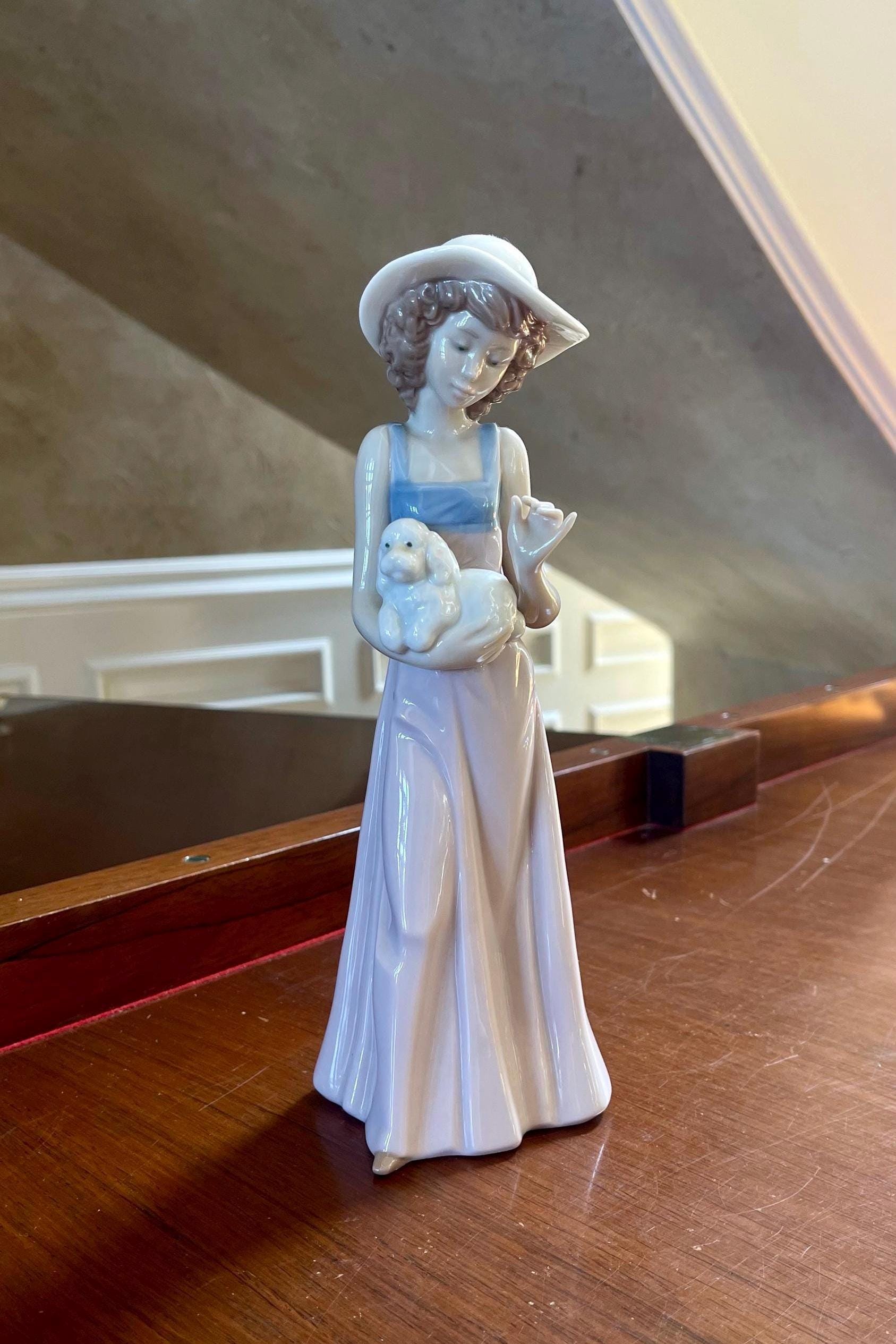 NAO Girl Holding Her Dog by Lladro Porcelain Figurine Made