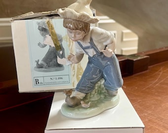 NAO by Lladro Porcelain “Boy With The Bird’s”  No.1096 Figurine Made in Spain With Box