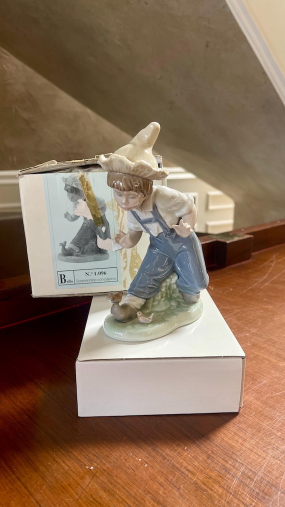 NAO by Lladro Porcelain “boy With the Bird's” No.1096 Figurine