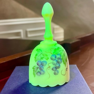 Fenton Uranium Burmese Glass Hand Painted Grapes Mini Bell Signed Bill Fenton And J Cutshaw; Fenton Uranium Glass Bell Glows