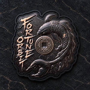 May include: A black and bronze-coloured patch featuring a koi fish swimming around a circular coin with a square centre. The text FORTUNE is written vertically in a stylised font on the left side of the patch, which has a scalloped edge.
