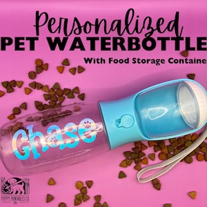 May include: A personalized pet water bottle with food storage. The clear bottle has the name "Chase" in iridescent lettering. The bottle is light blue and has a white cap. The background is pink with scattered pet food.