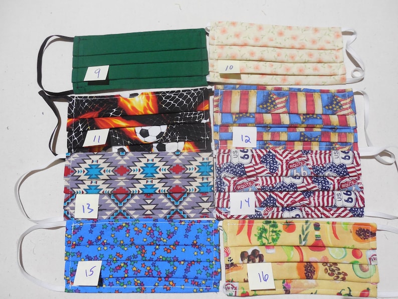 May include: A collection of 10 fabric face masks with various patterns, including green, floral, soccer, American flag, and southwestern designs. The masks are numbered 9 through 16.
