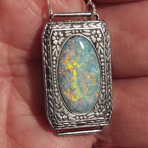 Opal pendant - #OpalWatching vintage art deco ladies watch case (circa 1930s) set with a Coober Pedy semi-crystal opal.
