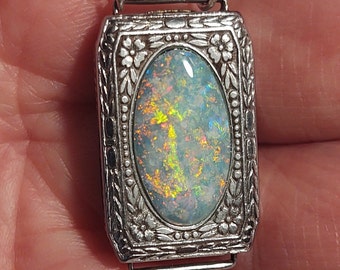 Opal pendant - #OpalWatching vintage art deco ladies watch case (circa 1930s) set with a Coober Pedy semi-crystal opal.