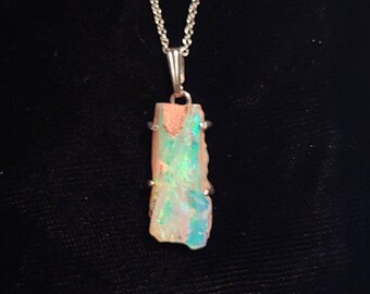 Opal pendant... Beautiful, almost glowing, blue-green-turquoise wood fossil replacement opal pendant in sterling silver