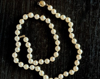 Dainty strand of Japanese round cultured pearls