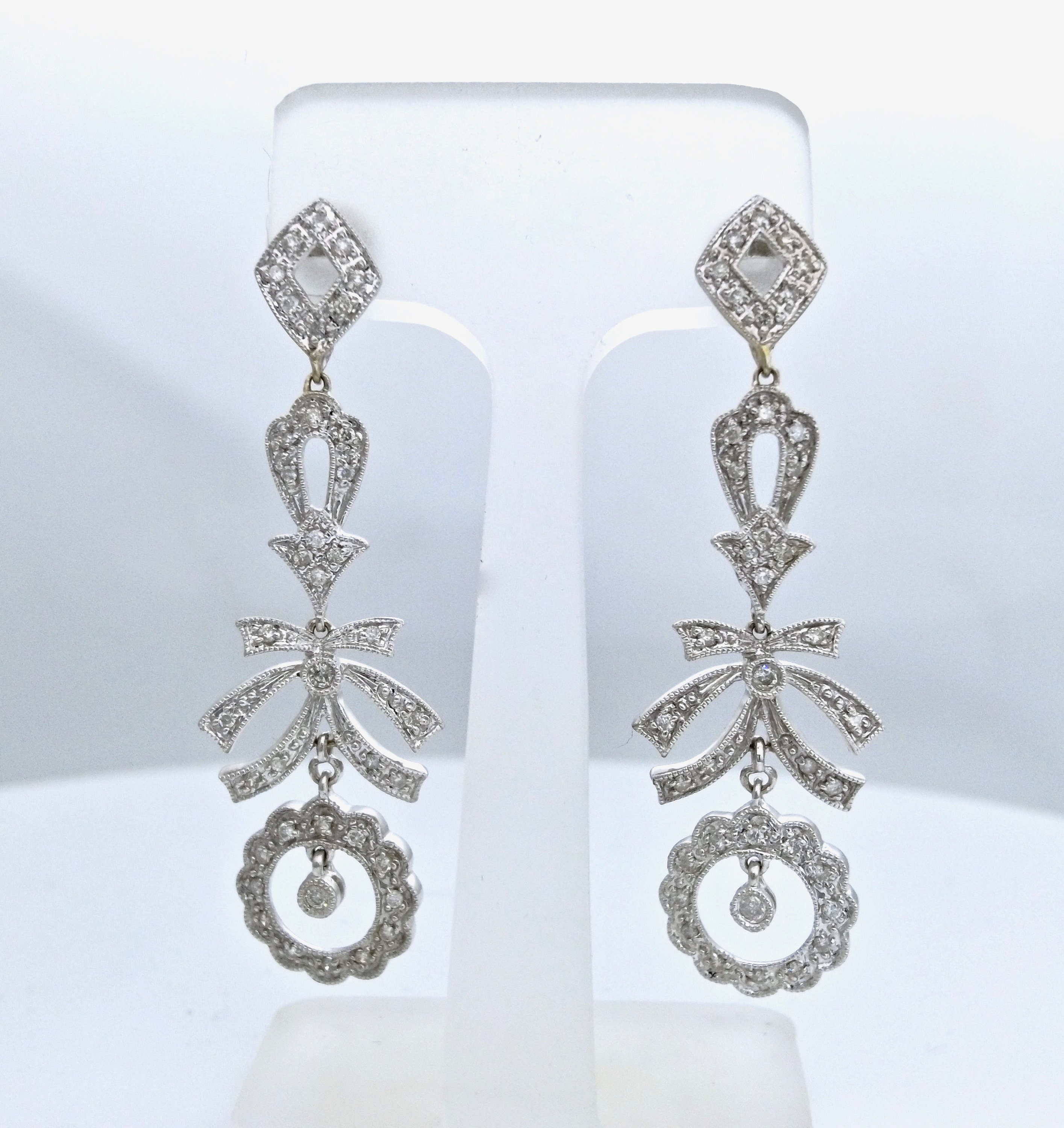 Half carat diamond earrings price store