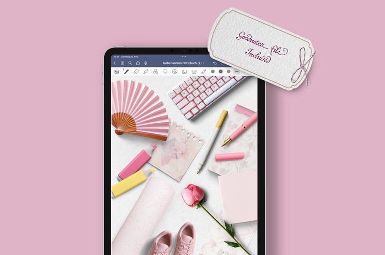 May include: A digital tablet displaying a flat lay of pink and white stationery items, including a pink fan, a keyboard, a pen, and a flower. The text "Goodnotes file included" is visible on a tag.