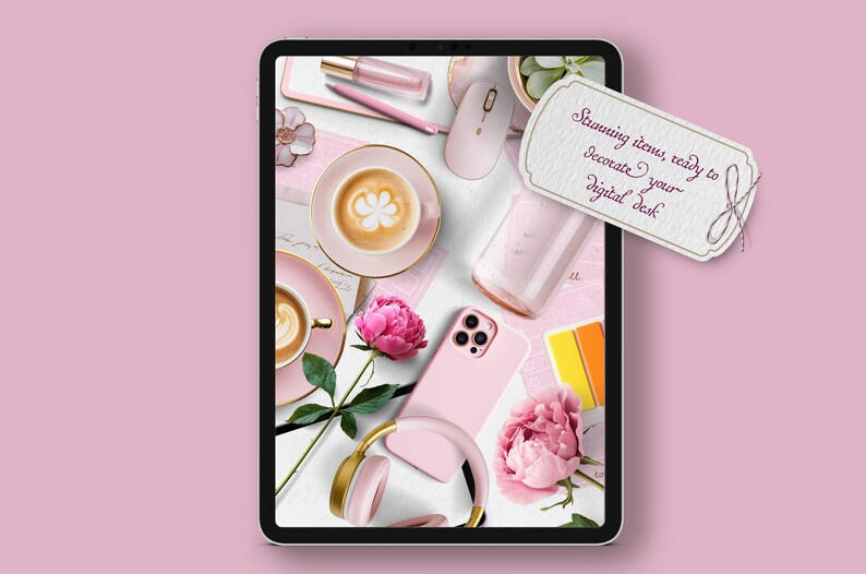 May include: A digital tablet screen displaying a pink and gold aesthetic with a phone, coffee cups, flowers, and headphones. The text on the screen reads "Stunning items, ready to decorate your digital desk."