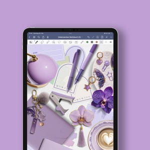 May include: A digital tablet displays a flat lay of purple stationery and accessories. Items include pens, a stapler, a journal, a pom-pom keychain, and an orchid. The color palette is monochromatic, with shades of purple and lavender.