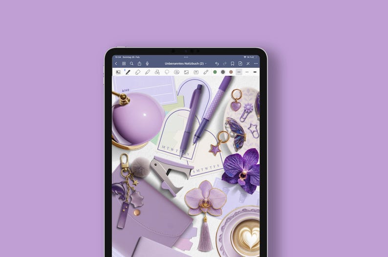 May include: A digital tablet displays a flat lay of purple stationery and accessories. Items include pens, a stapler, a journal, a pom-pom keychain, and an orchid. The color palette is monochromatic, with shades of purple and lavender.
